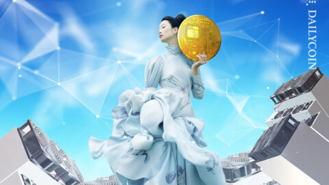 Woman shows of her massive crypto coin as the mining rigs blow wind on her.